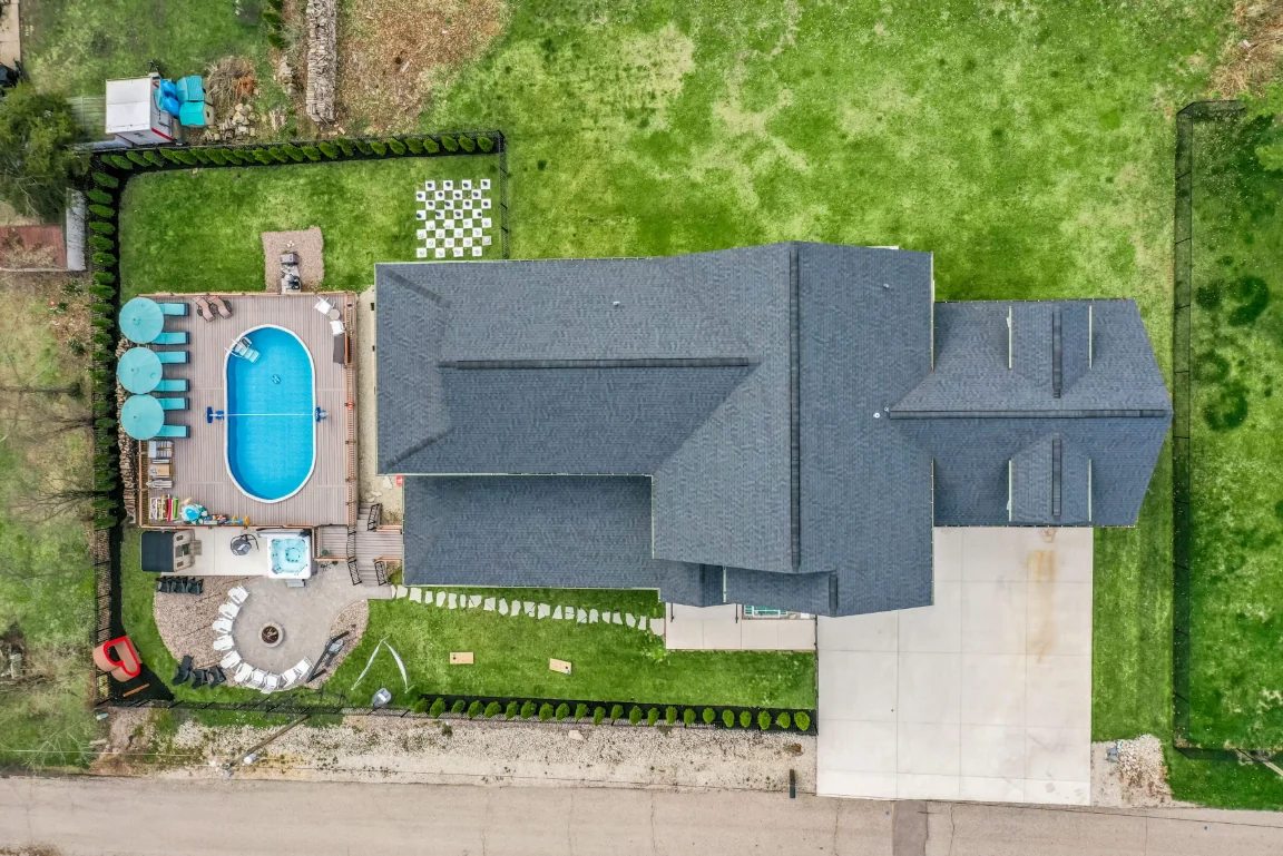 Aerial site plan showing the house, pool deck, hot tub, fire pit and lawn