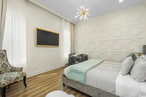 Bedroom with paneled wall