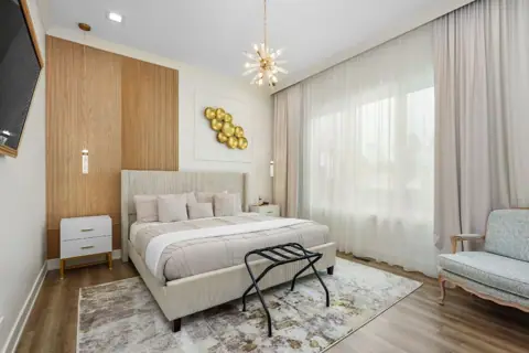 King bedroom with lounge chairs