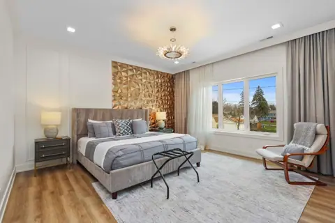 King bedroom with stone accent wall