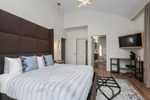 King bedroom with upholstered headboard